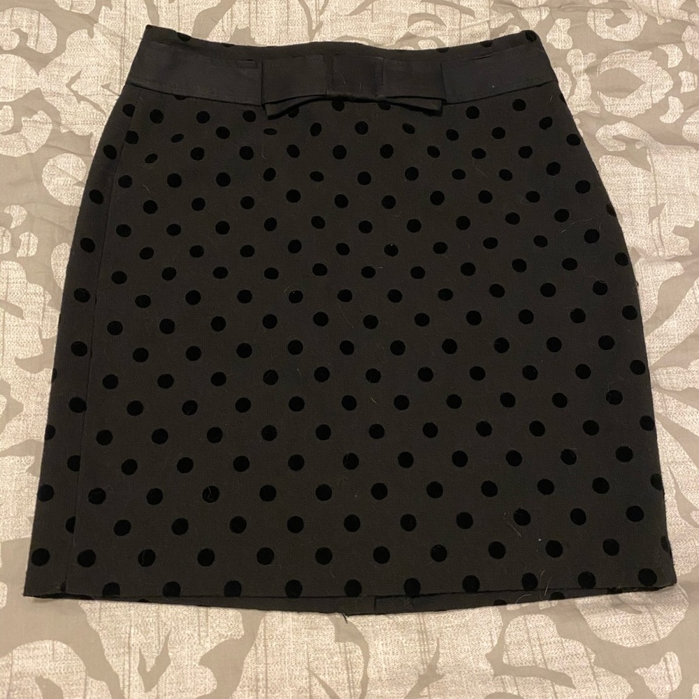 Black polkadot pencil skirt with bow detail